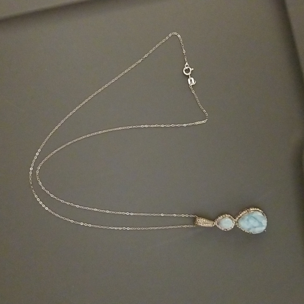 Beautiful sterling silver pendant with larimar stones